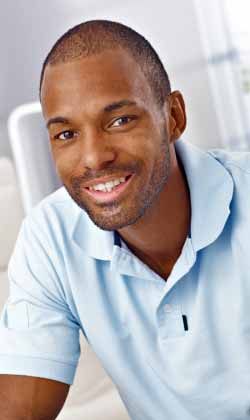 smiling man in autism treatment program